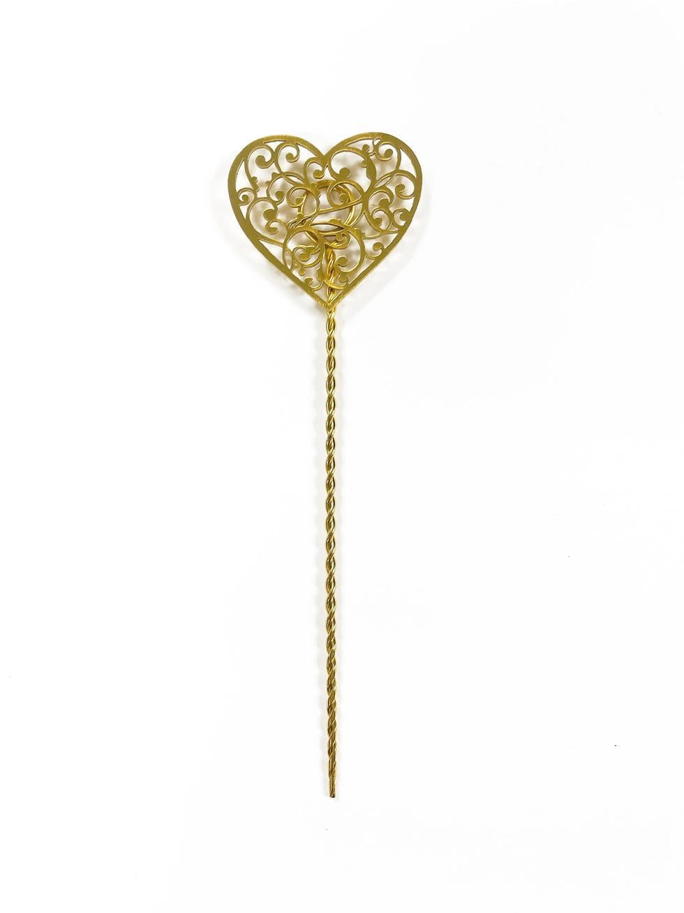 Gold heart-shaped plant stake on a white background
