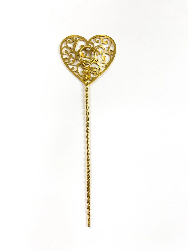 Gold heart-shaped plant stake on a white background