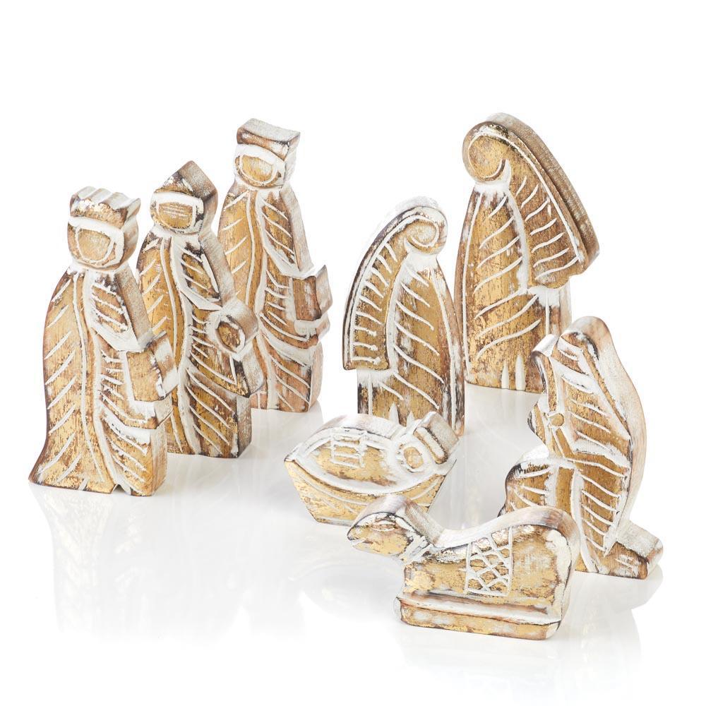 A hand-carved wooden nativity set with whitewashed figures 