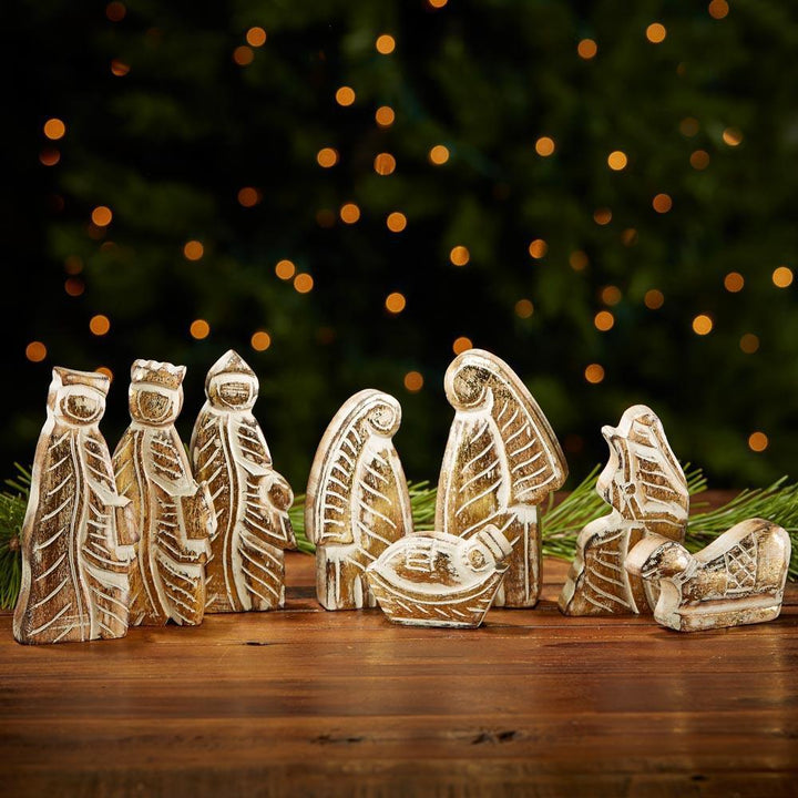 Heirloom nativity set up by Christmas tree