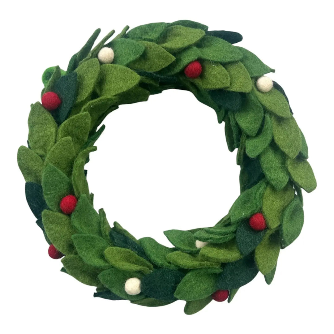 A green felted wreath with red and white ball accents. 