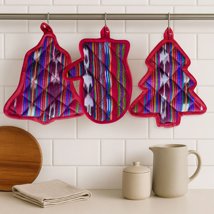 Colorful patterned pot holders hanging on a rack with kitchen items below.