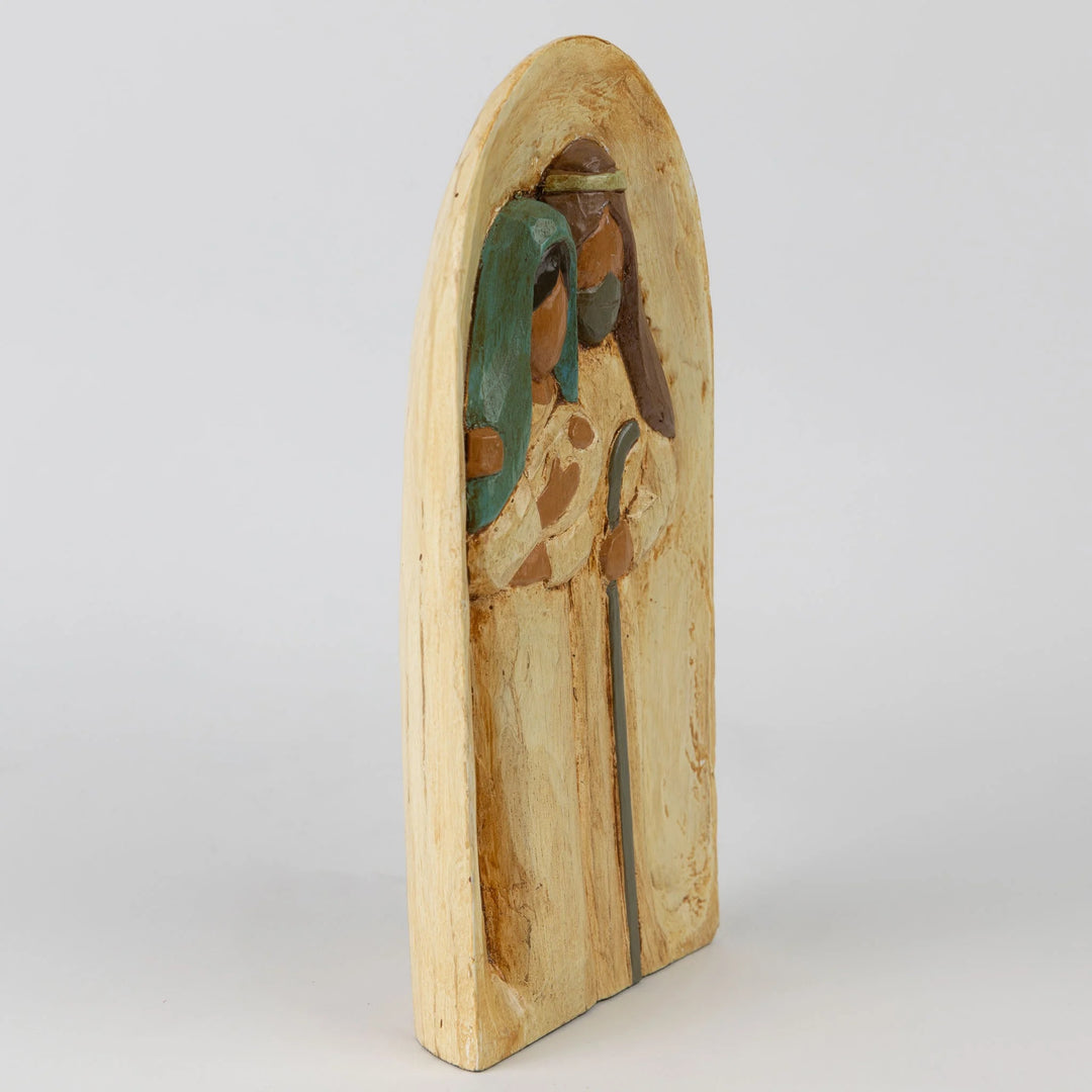 Carved holy family on white background