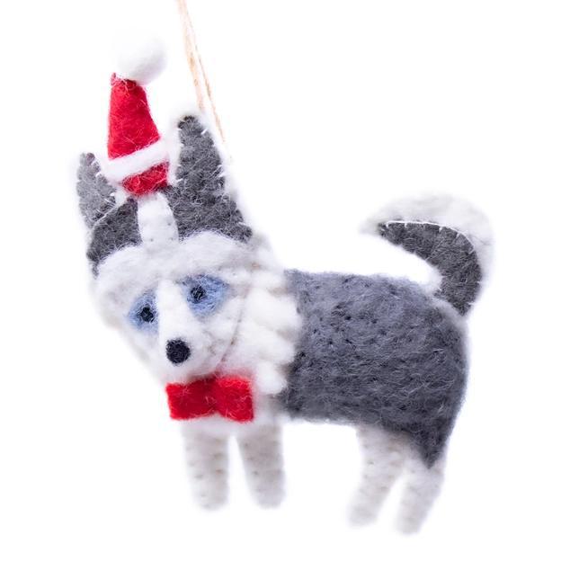 Felted dog ornament with a Santa hat and red bow tie on a white background