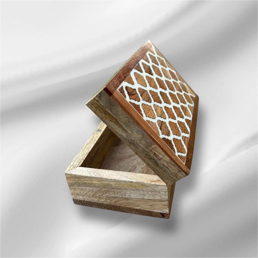 Wooden box with geometric pattern on a white background