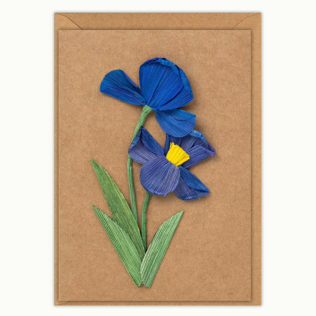 Card with blue flower design on a brown background