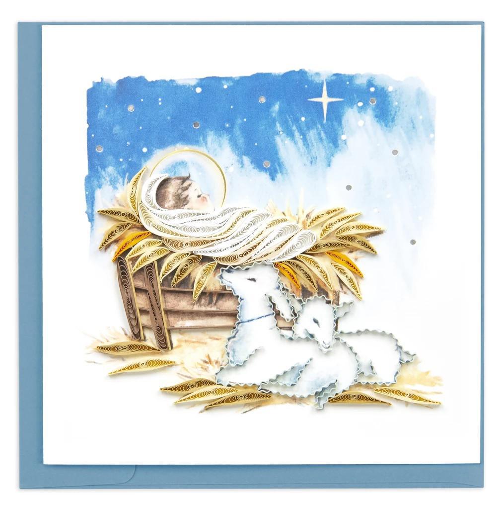 Quilling Christmas card with baby Jesus in a manger, starry sky, and sheep.