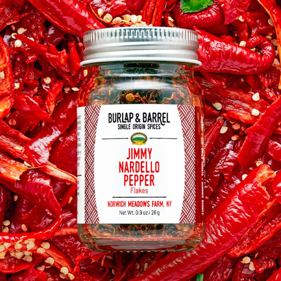 a jar Jimmy Nardello pepper flakes on top of pepper.