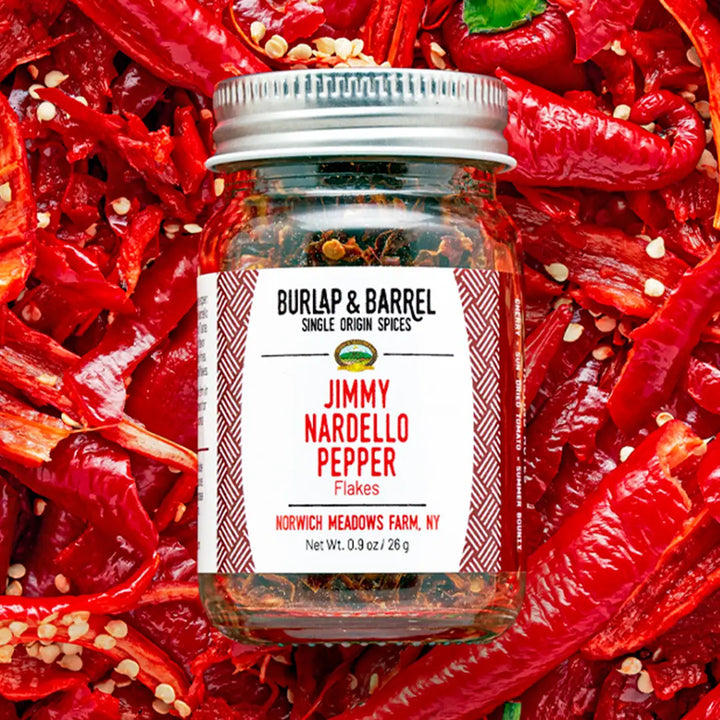 a jar Jimmy Nardello pepper flakes on top of pepper.