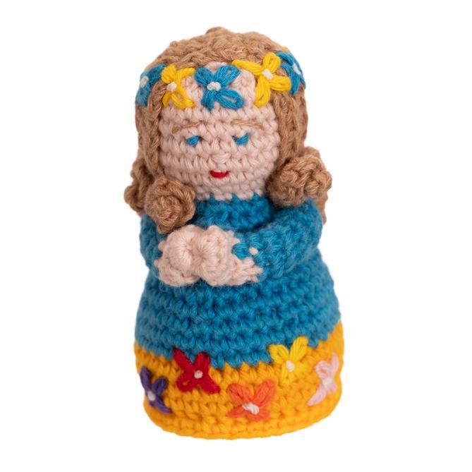Close up of hand crocheted Mary with her hands together from the nativity scene. 