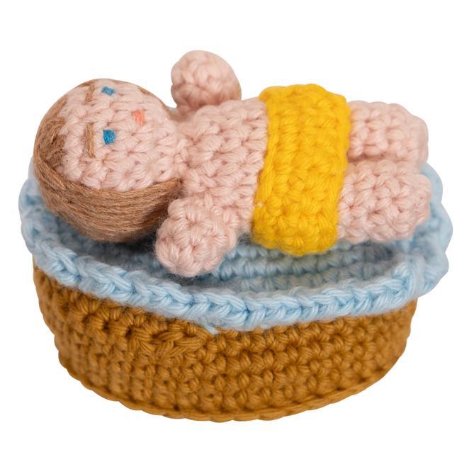 Close up of hand crocheted baby Jesus from the Nativity scene.