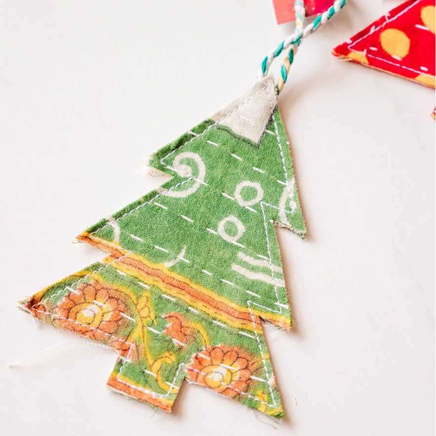 green patterned kantha christmas tree ornament on a white background