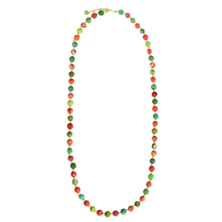 A beaded necklace made of small round beads in red and green, with a gold clasp, shown on a plain white background.