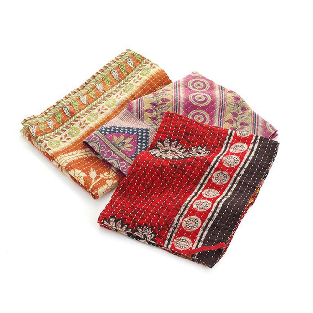 A set of colorful Kantha dish towels with traditional Indian patterns displayed on a white background.