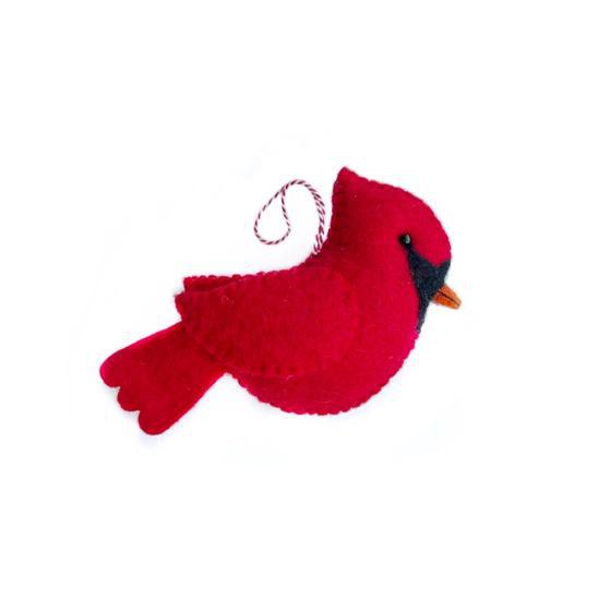 A red large cardinal felt ornament on a white background
