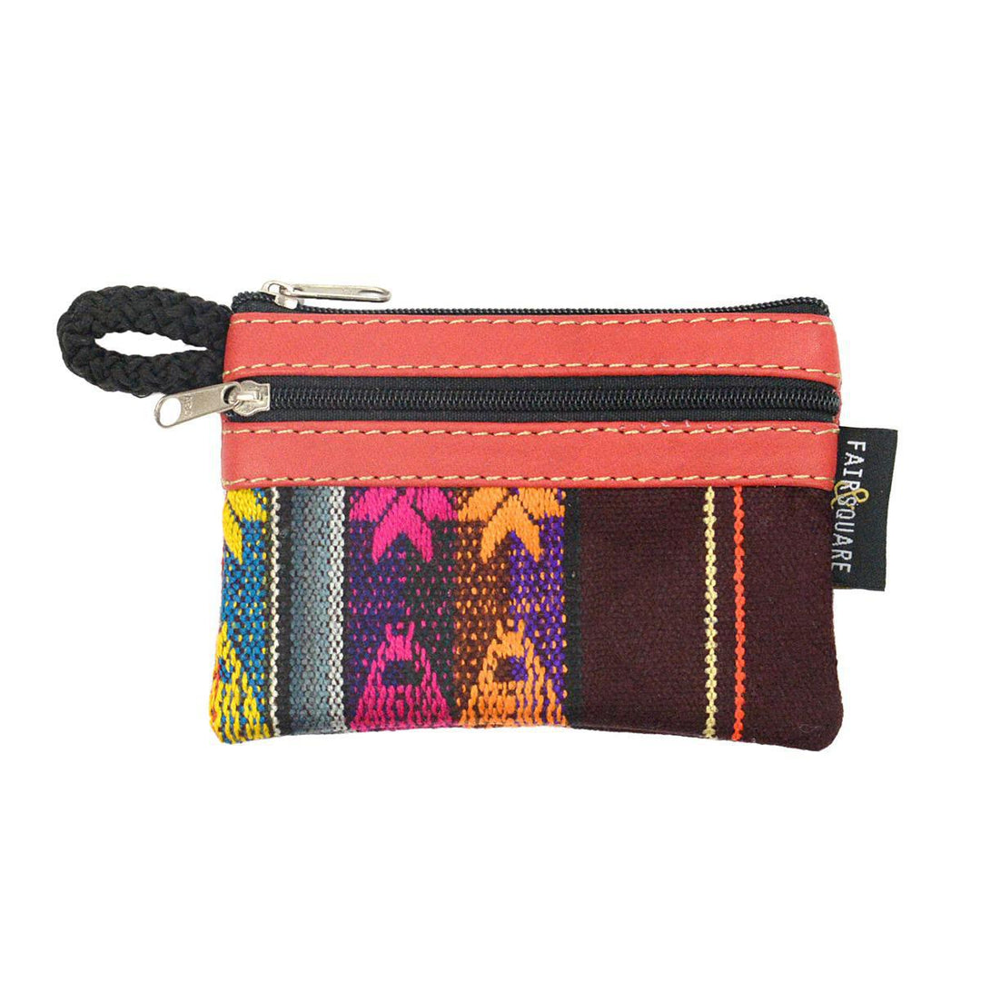 Small pouch with colorful pattern and red top section on a white background