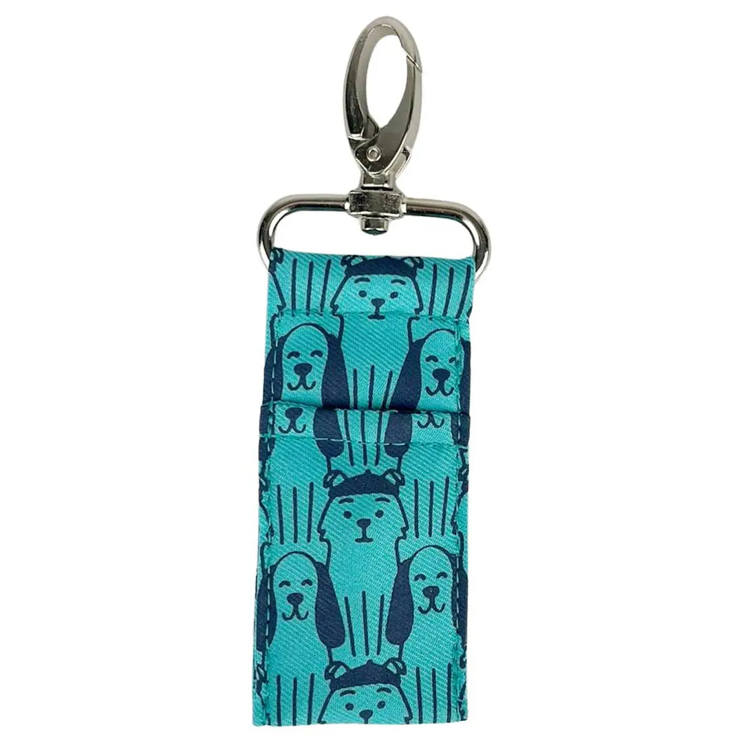Teal keychain with dog pattern on a white background
