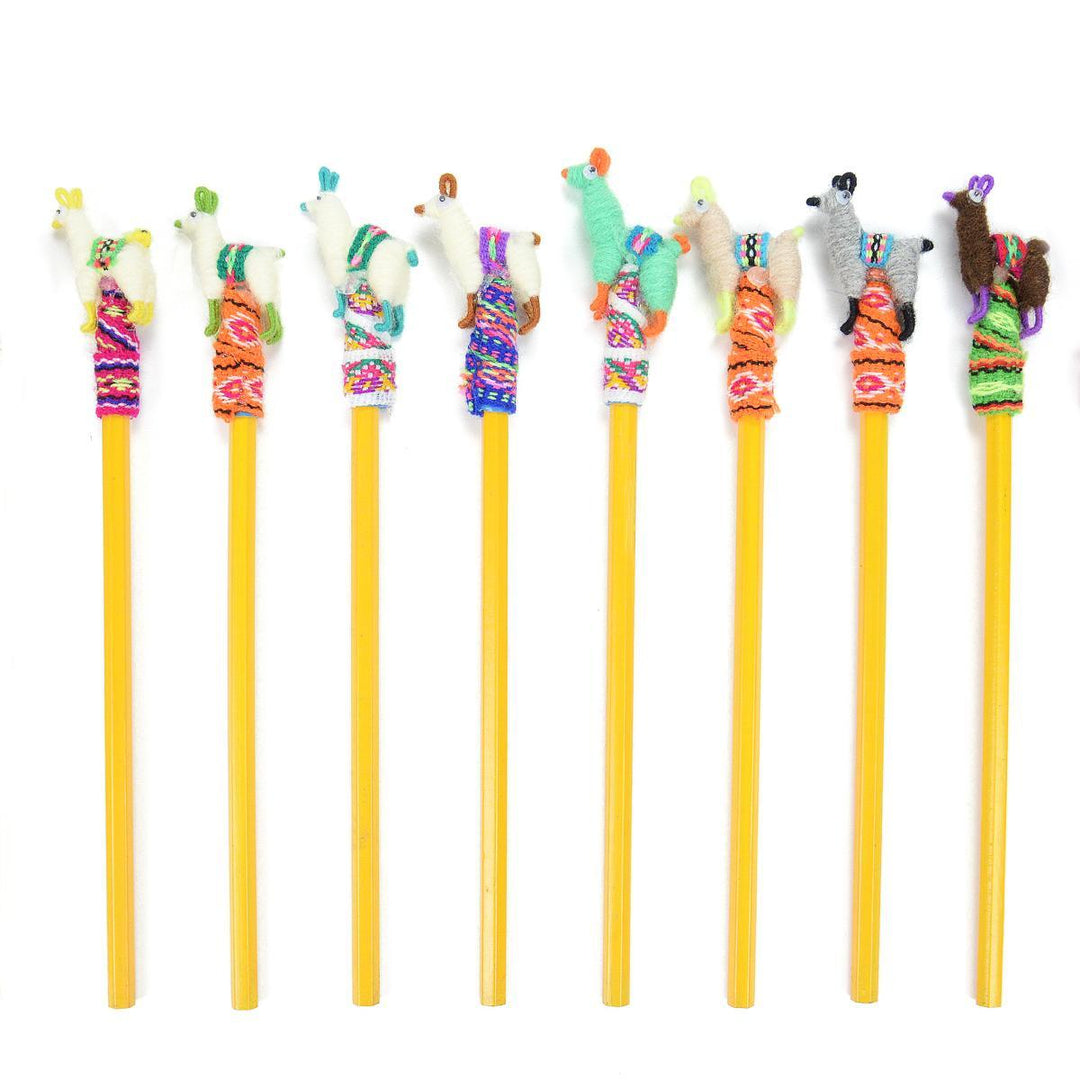 Set of colorful pencils with llama-shaped toppers on a white background