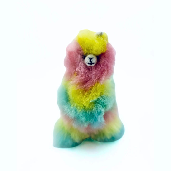 A mint, pink and yellow llamacorn on a white background.
