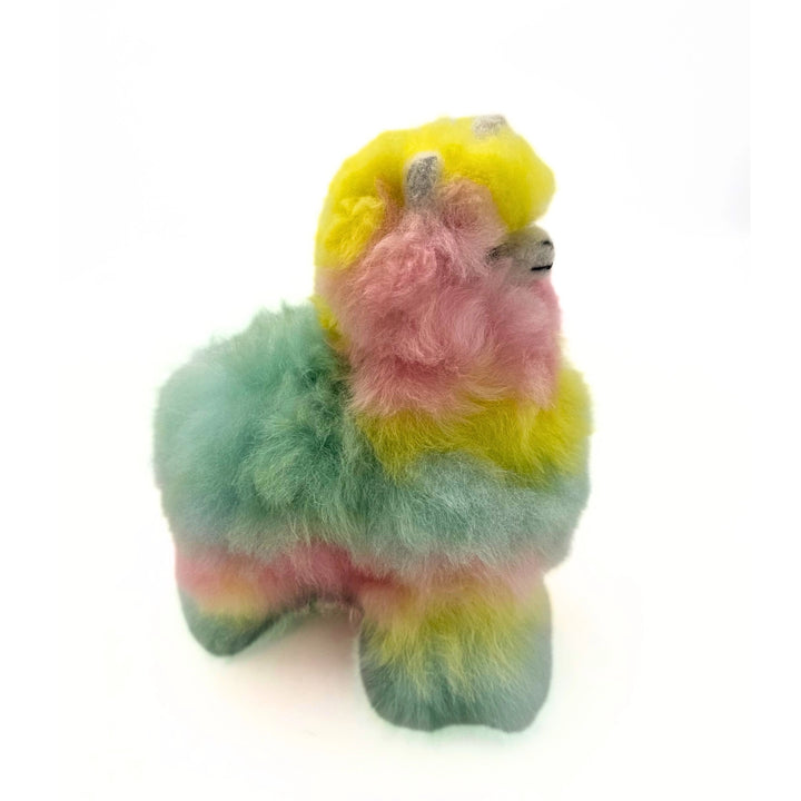 A mint, pink and yellow llamacorn on a white background.