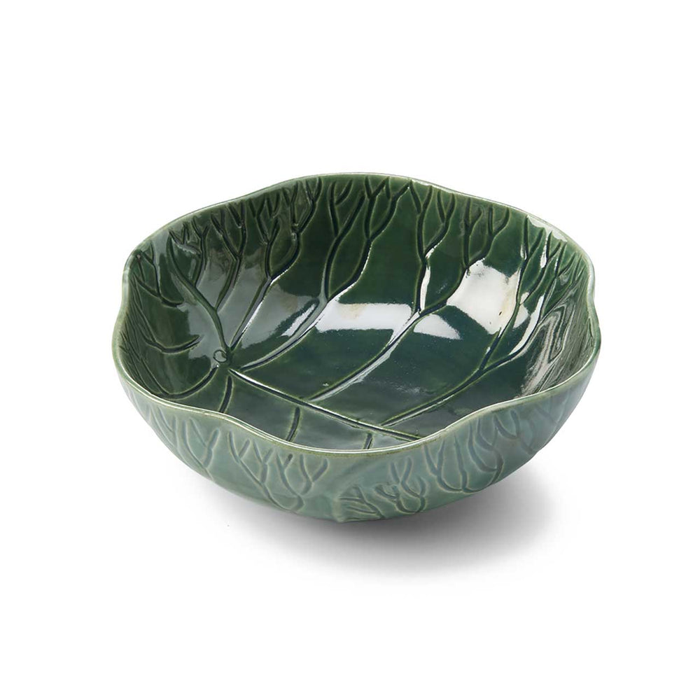 Green ceramic leaf-shaped bowl on a white background