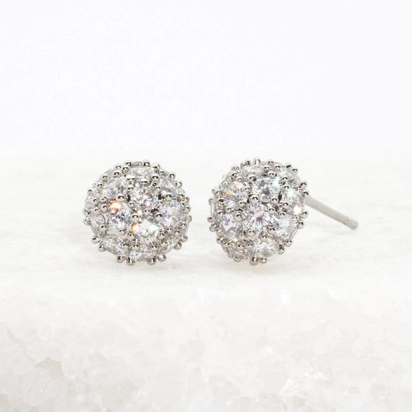Pair of silver stud earrings with clear gemstones on a white background
