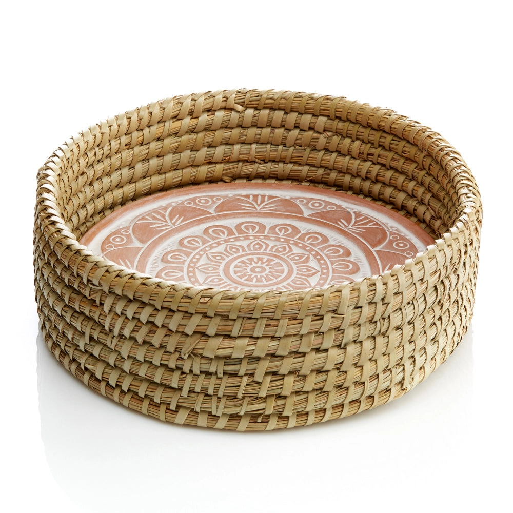 Woven basket and breadwarmer with a mandala design on a white background