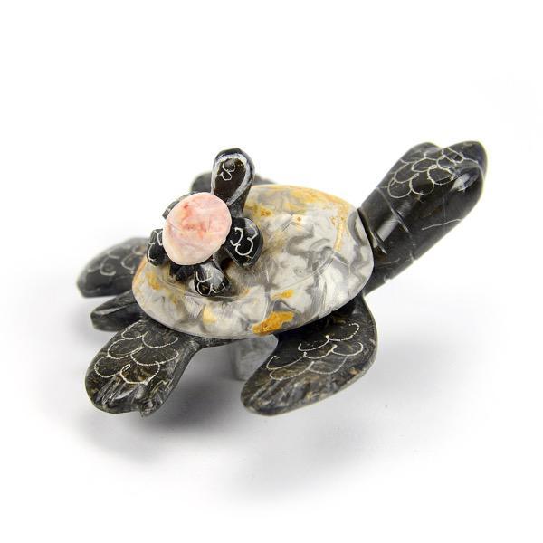 Decorative turtle figurine made from marble and onyx on a white background