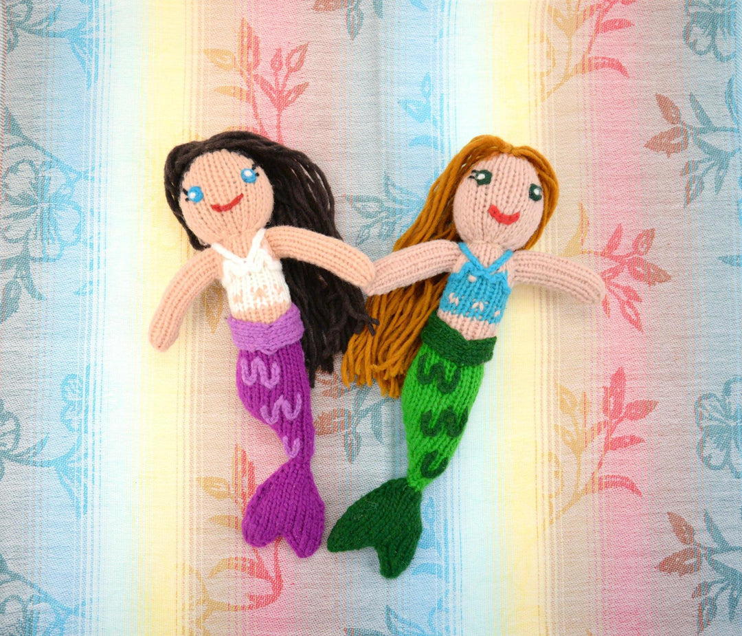A handmade wool doll depicting two mermaids
