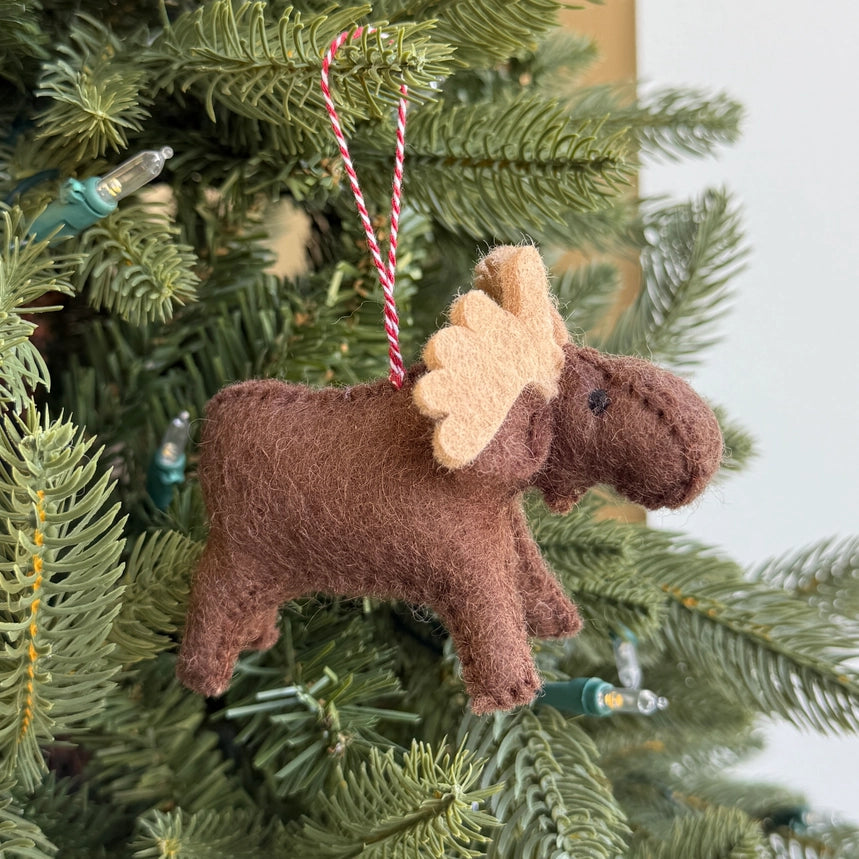 Moose-shaped Christmas ornament on a tree
