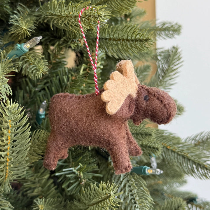 Moose-shaped Christmas ornament on a tree