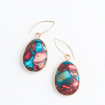 Multicolored oval earrings on a white background