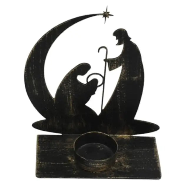 Distressed black metal nativity scene candle holder with silhouette cutouts of Mary, Joseph, baby Jesus, a shepherd, and a crescent moon under a star, with a small round candle cup on a rectangular base.