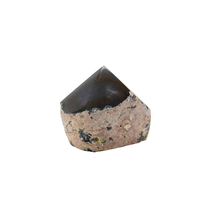 Decorative stone with a pointed top on a white background