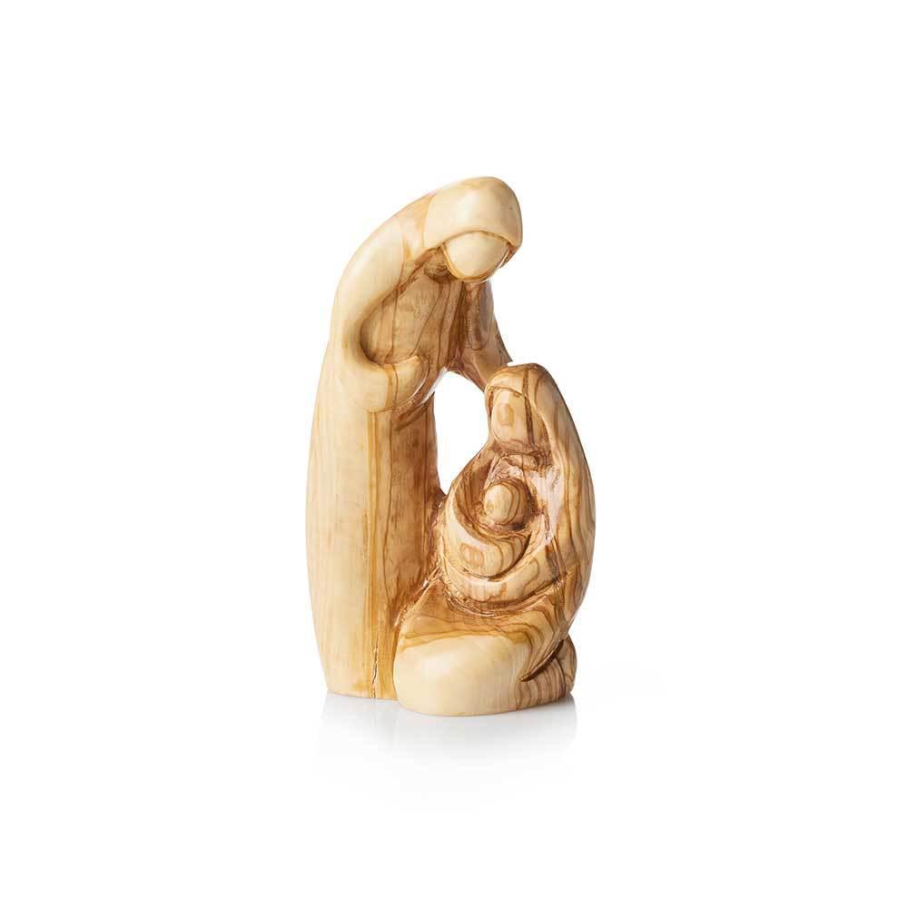 A hand-carved olive wood sculpture depicting the Holy Family, featuring three figures in a protective embrace.
