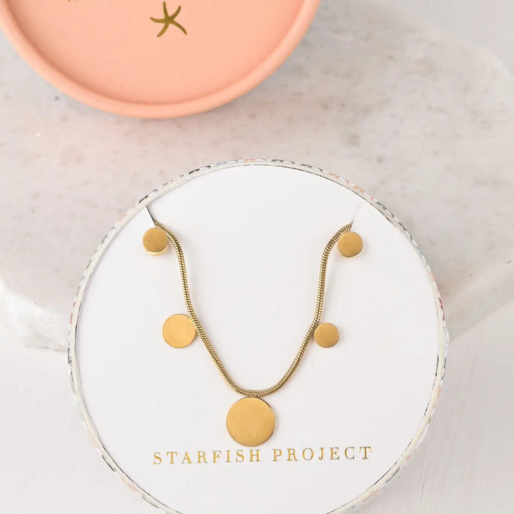 gold plated chain with gold disks in a Starfish Project gift box