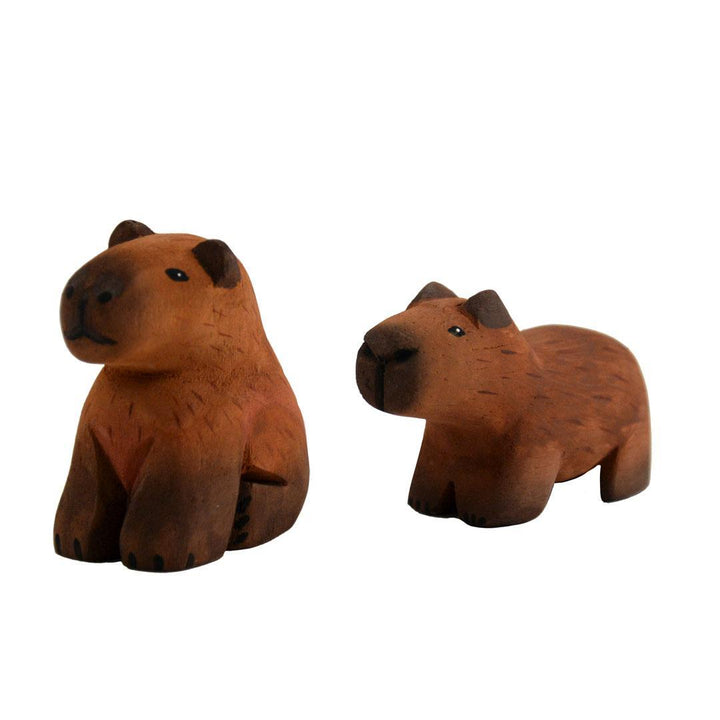 two painted balsa wood cabybaras