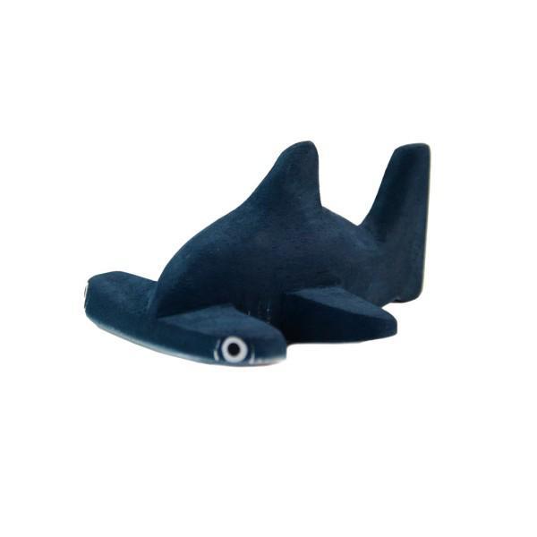 k painted balsa wood hammerhead shark on a white background