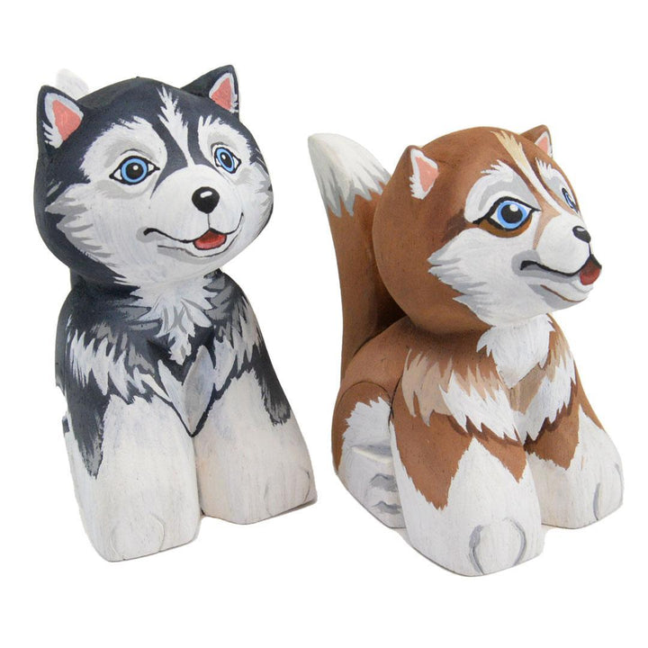 two painted balsa wood huskys