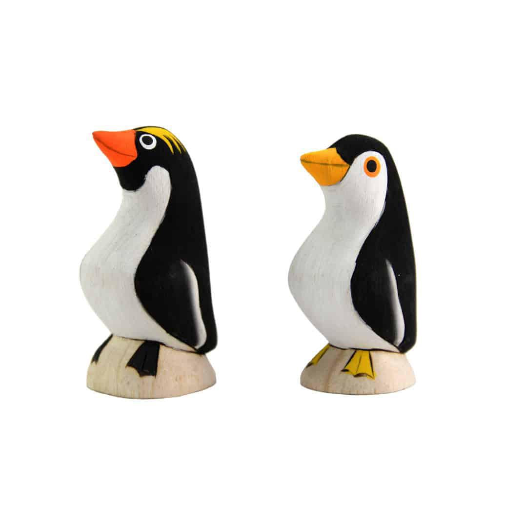 two painted balsa wood penguins 