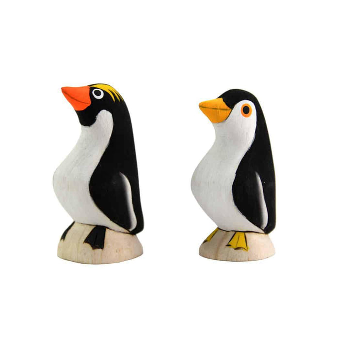 two painted balsa wood penguins 