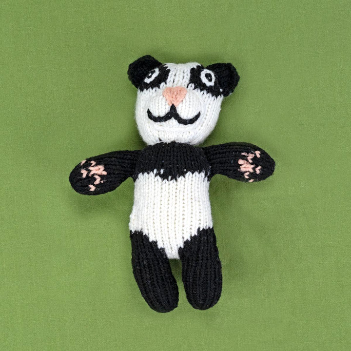 A handmade wool doll depicting a black and white panda