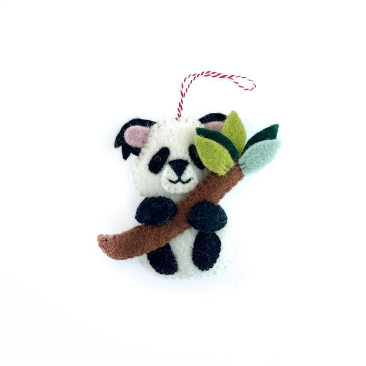 Felt panda ornament holding a branch with leaves on a white background