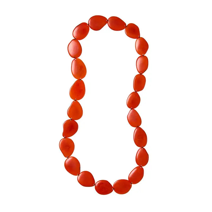 Necklace with tagua red beads on a white background