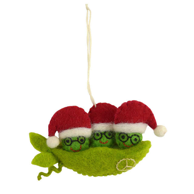Felt ornament of three peas in a pod with Santa hats on a white background