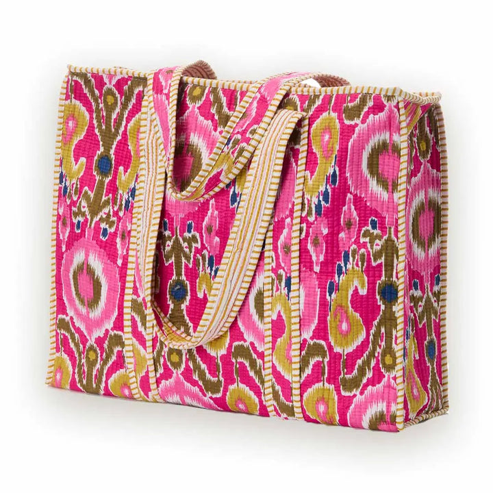 Pink patterned tote bag on a white background