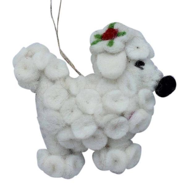 White fluffy poodle dog ornament with a red nose and green leaves on a white background