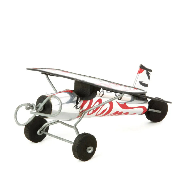 Model airplane with a Coca-Cola logo on a white background