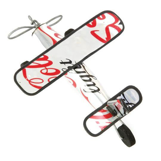 Model airplane with red and black cola logo design on a white background