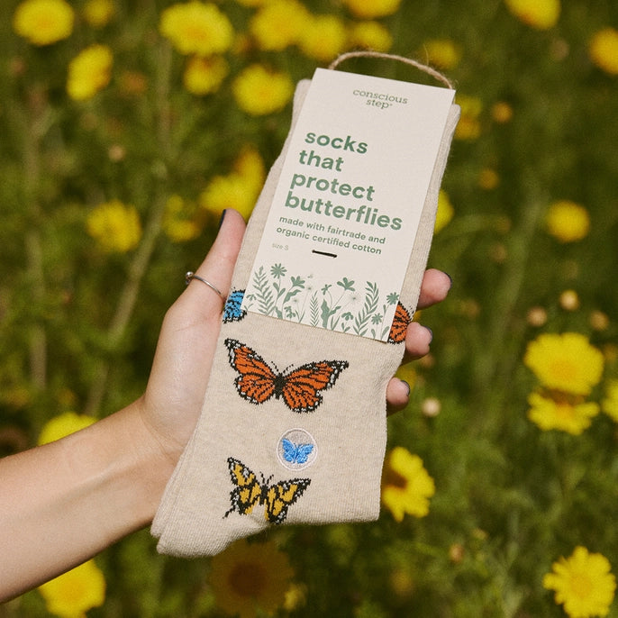Beige crew socks that protect butterflies with butterflies